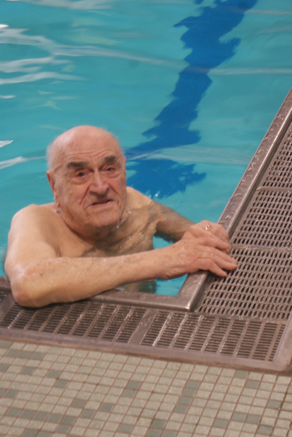 AT EASE: Longtime Cranston YMCA member Frank Mancini, 98, enjoys his time in the pool. He finds it to be a healthy way to exercise, socialize and have fun